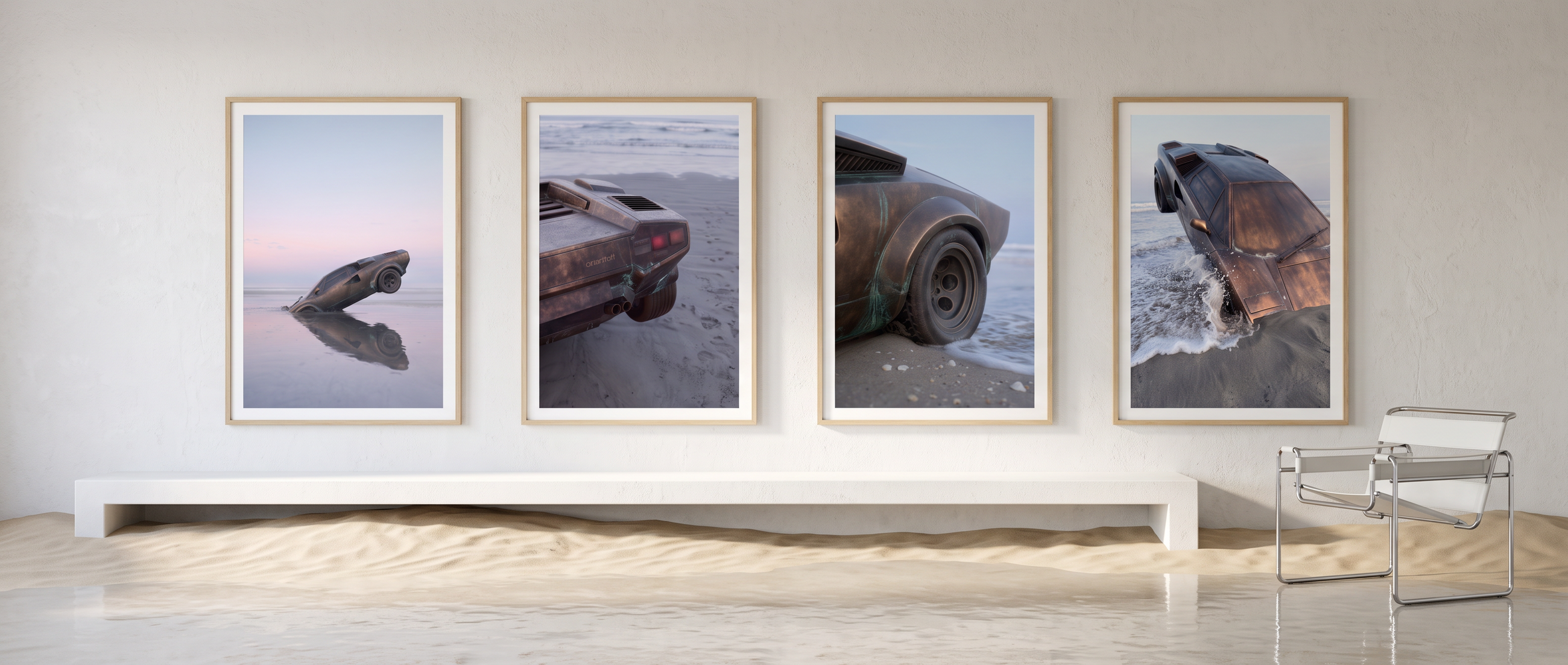 The four NOSTOS prints in oak frames in a white room where sand has drifted across the floor