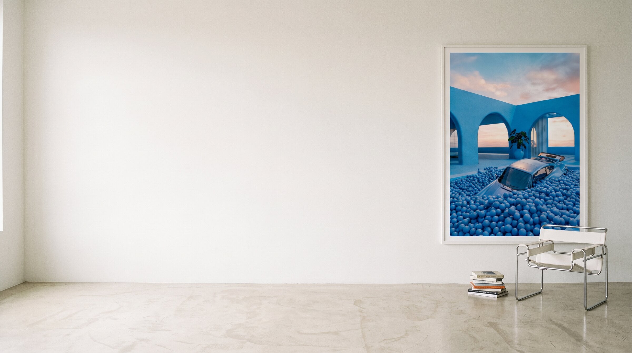 AZUR 01 framed on a white wall above a chrome chair