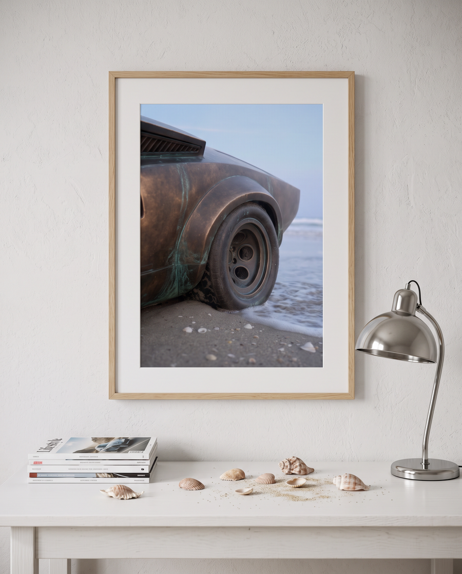 NOSTOS 03 in an oak frame above a white desk with shells