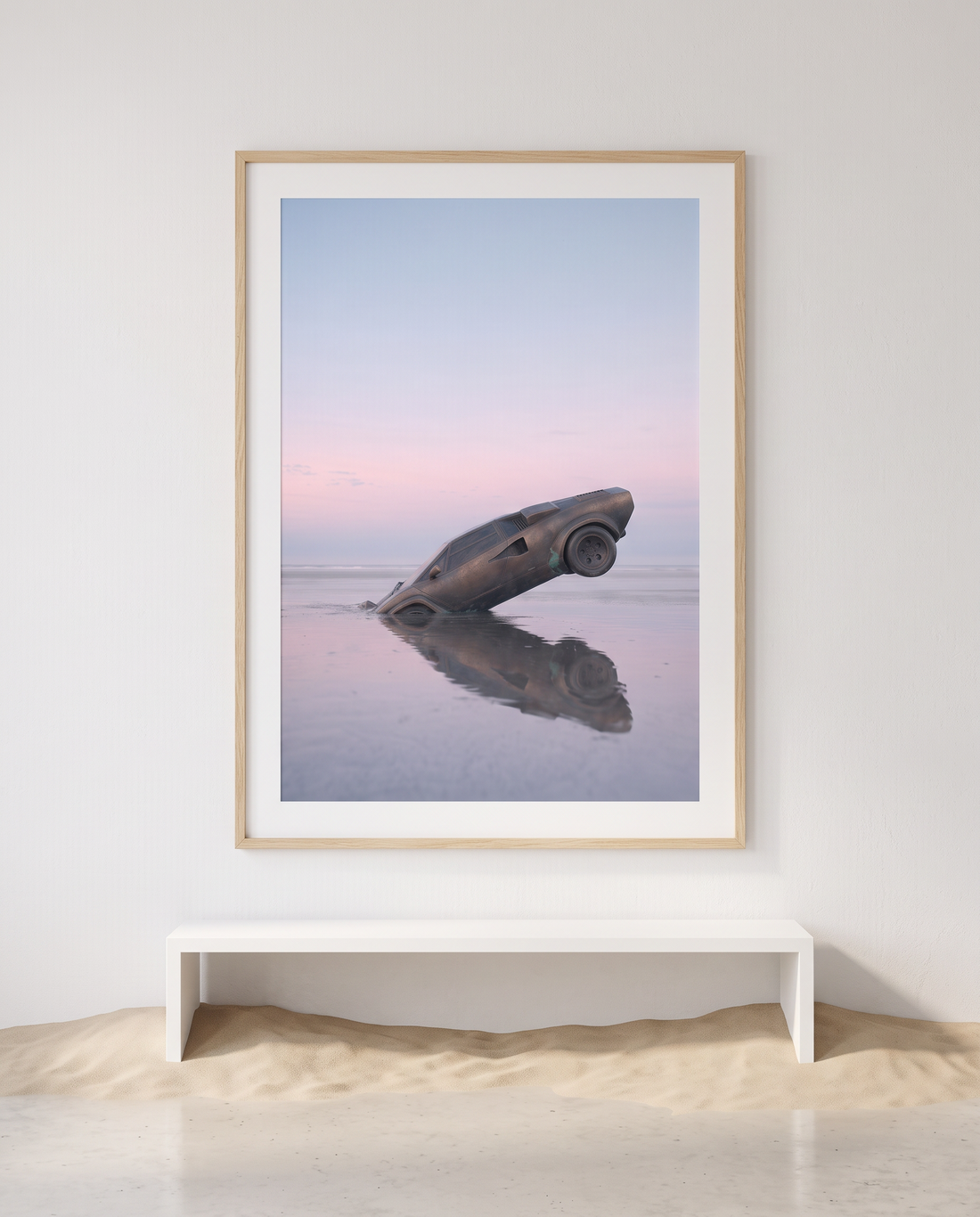 NOSTOS 01 in an oak frame above a white bench, sand drifting across the floor
