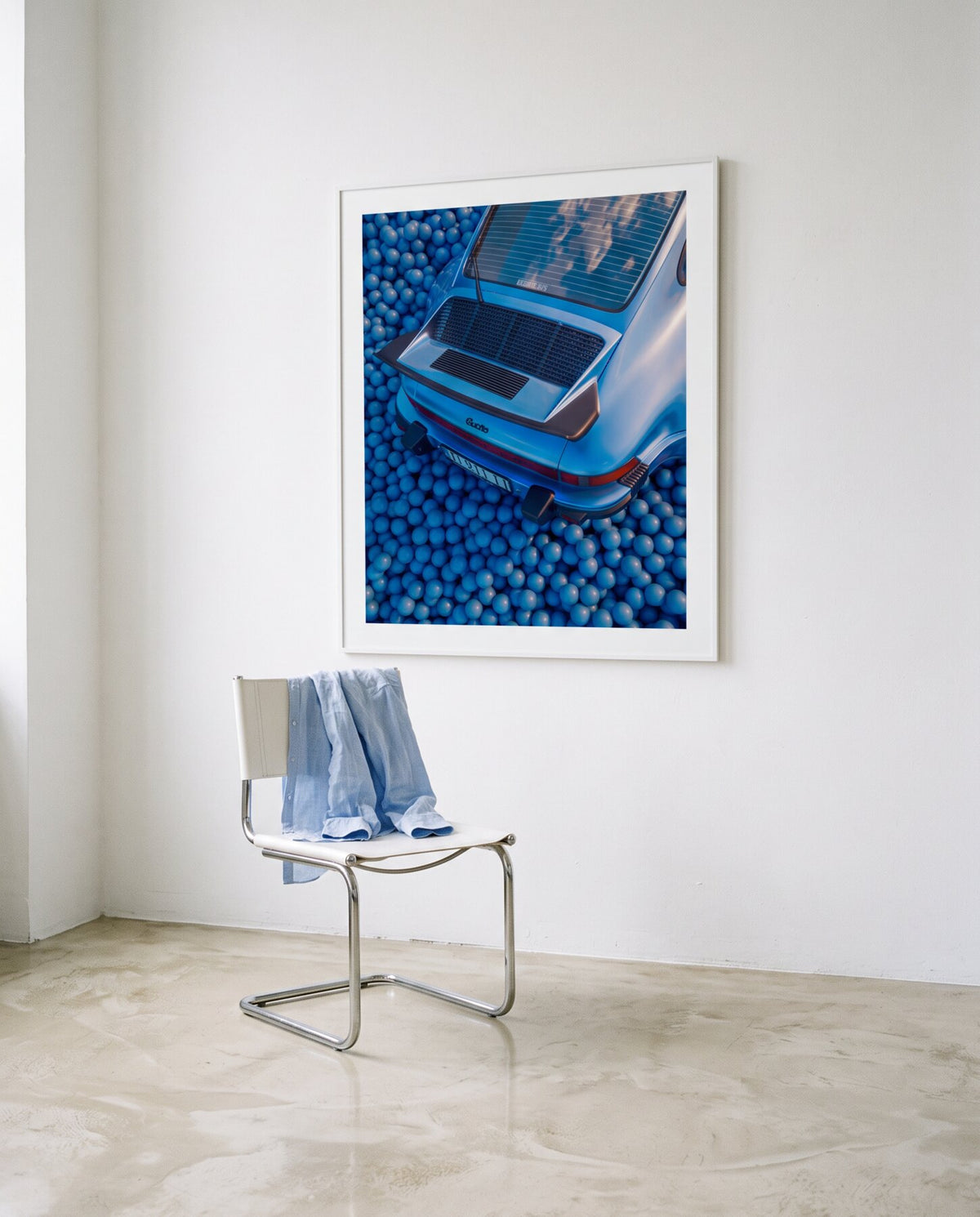 AZUR 03 framed in a white studio above a chrome chair