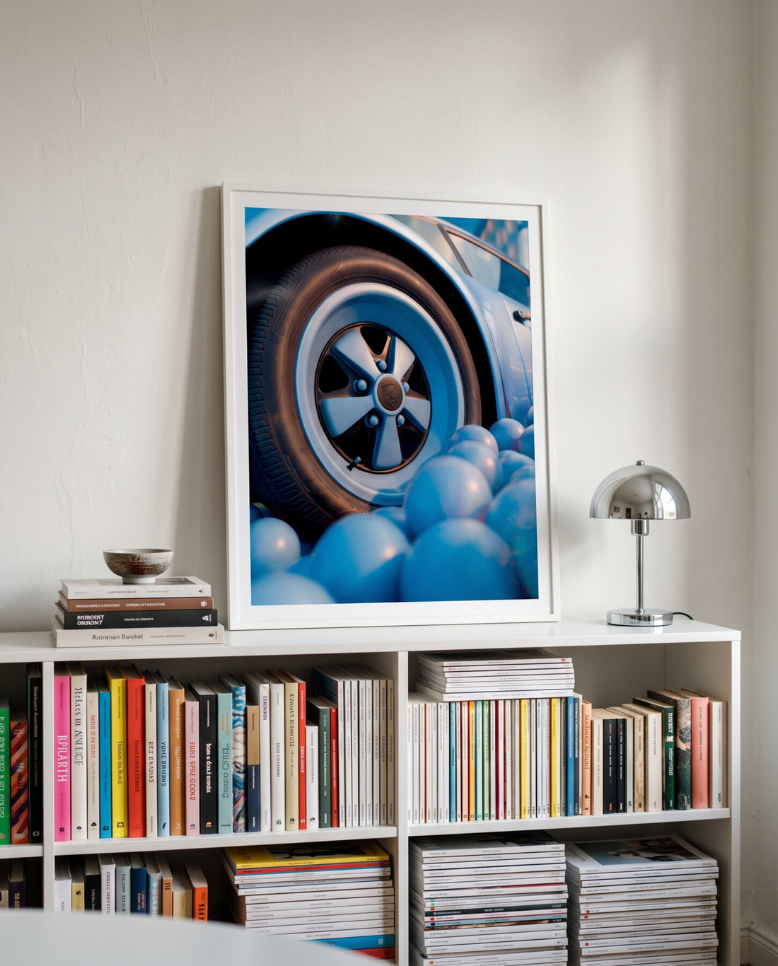 AZUR 04 framed, standing on a white bookshelf
